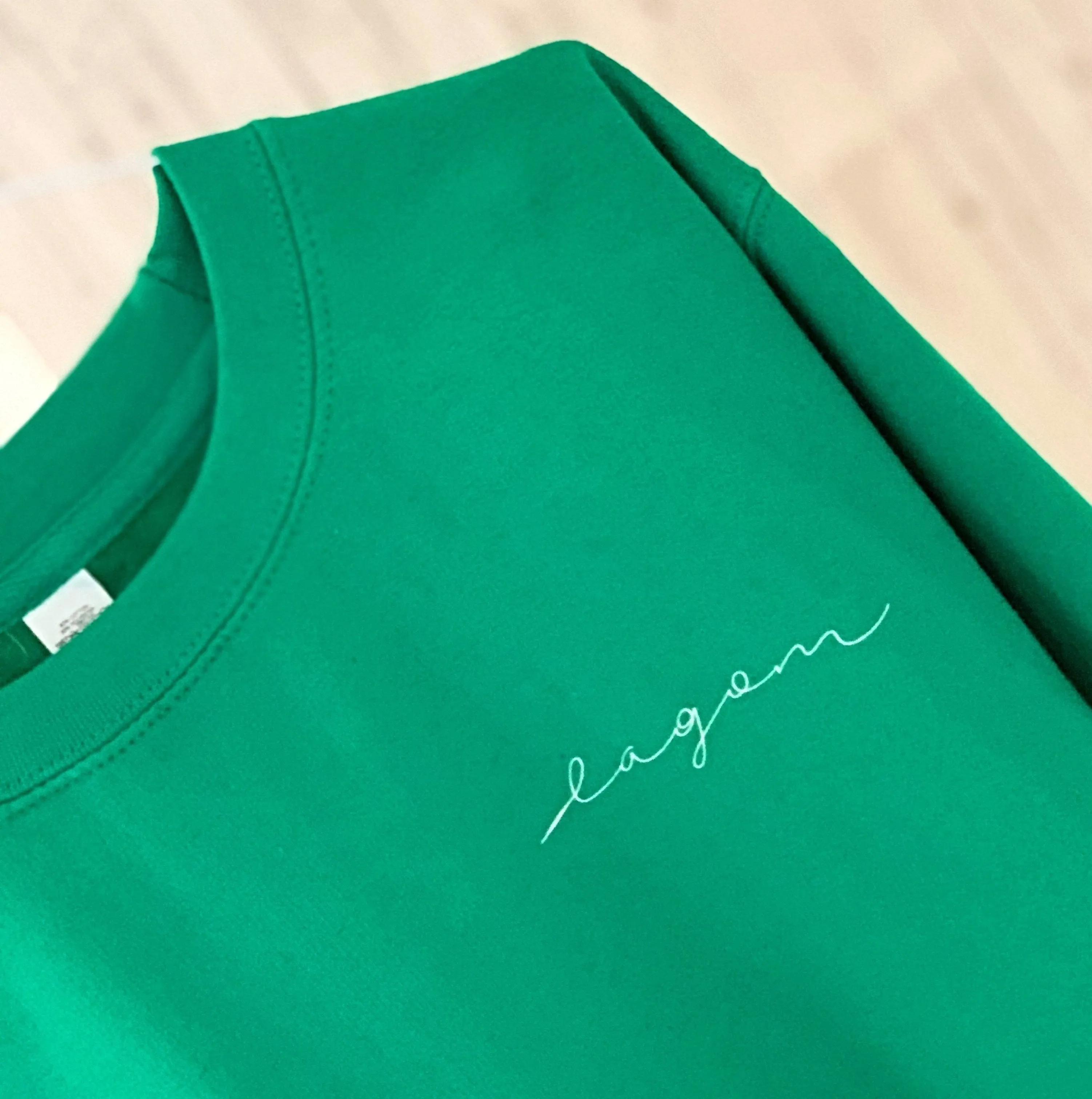 LAGOM on bright green sweatshirt